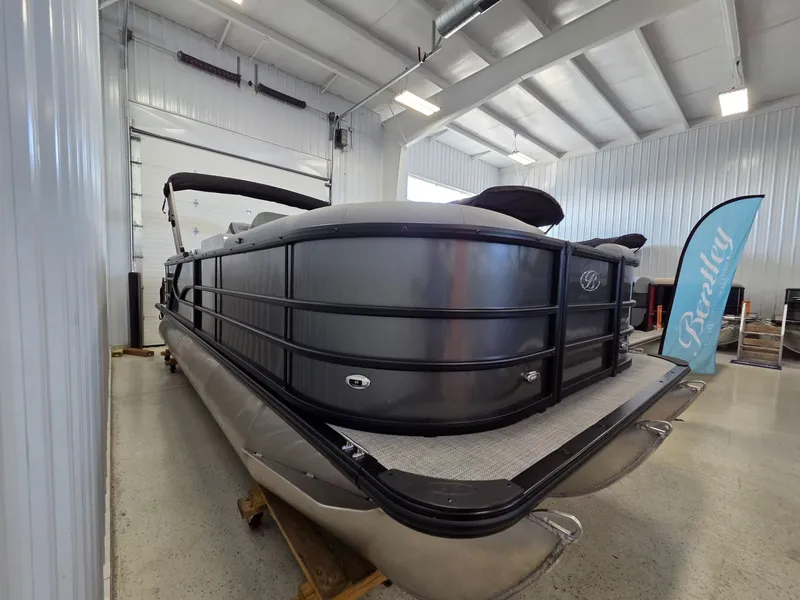 Slide: The Image of 2026 Bentley Pontoons Legacy 223 Navigator in a showroom. - 5