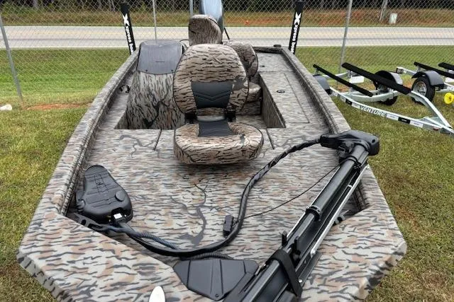 Slide: The Image of 2026 Xpress XP170 boat with camouflage design, featuring seating and trolling motor. - 3