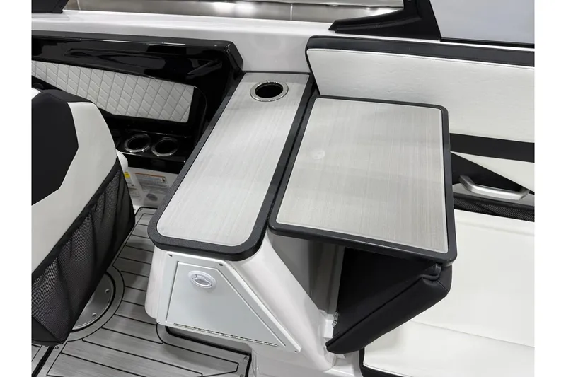 Slide: The Image of 2025 Yamaha Boats 252S interior with sleek seating and modern table design. - 10
