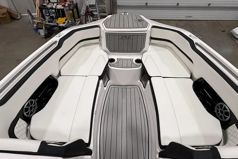 Slide: The Image of 2025 Yamaha Boats 252S interior with white seating and modern design. - 5
