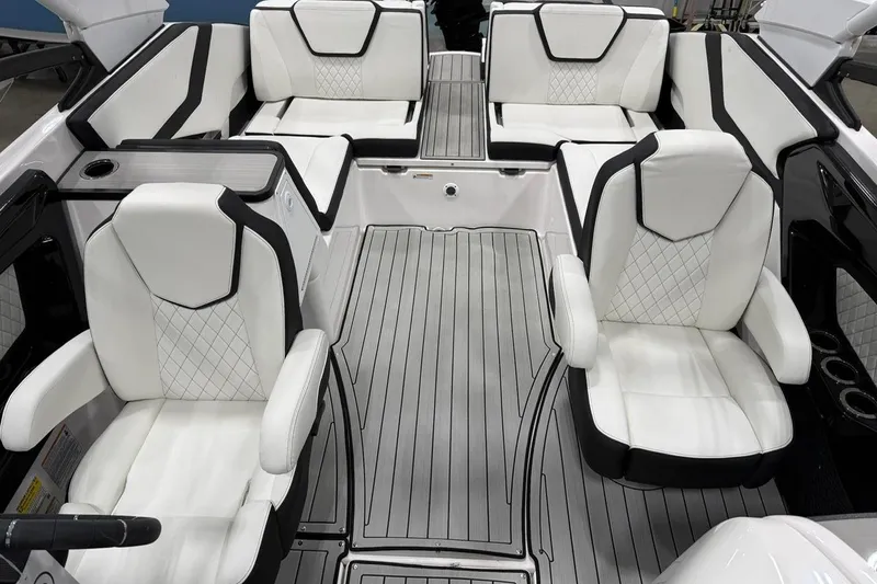 Slide: The Image of 2025 Yamaha Boats 252S interior with luxurious white seating and sleek design. - 9