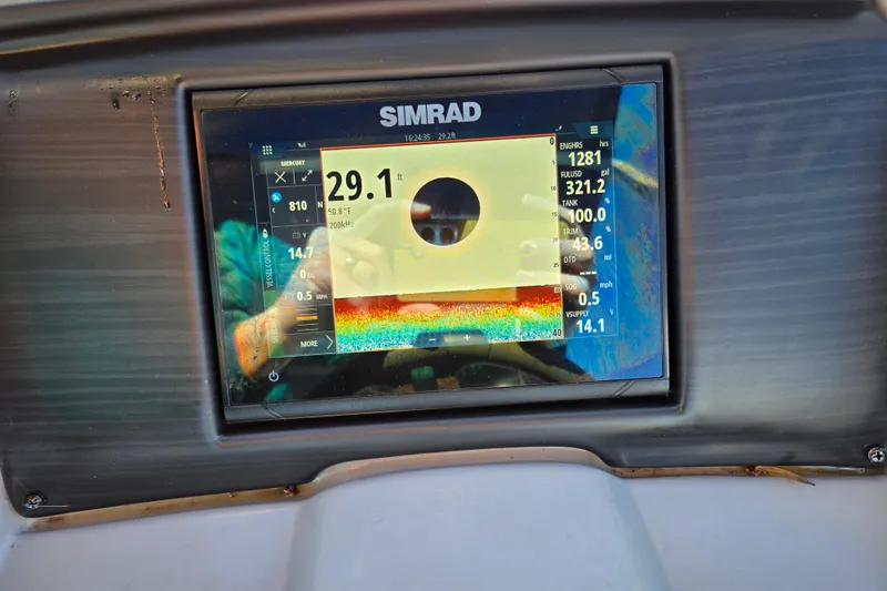 Slide: The Image of Simrad display on 2023 Bennington 22 SSR showing depth and navigation data. - 20