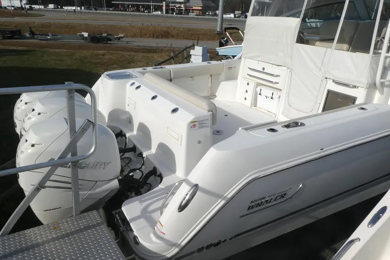 Slide: The Image of 2020 Boston Whaler 345 Conquest boat with triple Mercury outboard engines. - 1