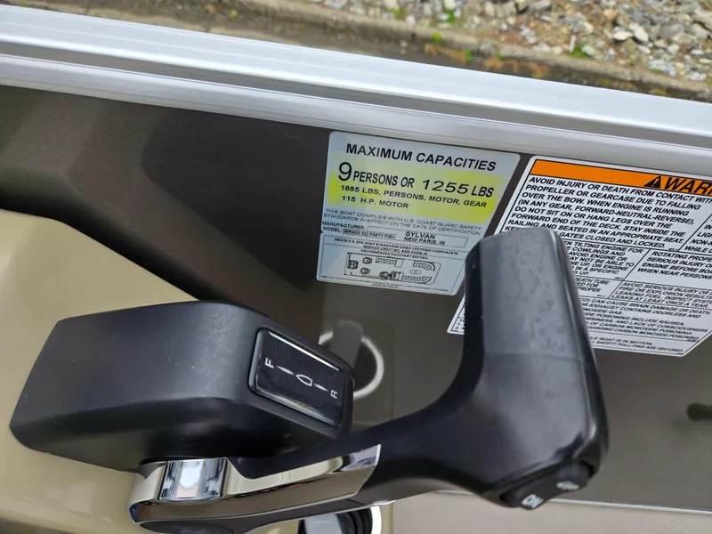 Slide: The Image of Control lever and capacity label on 2022 Sylvan Mirage Fish 822 Party Fish boat. - 23