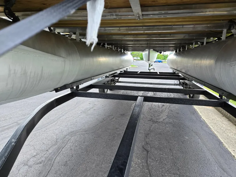 Slide: The Image of Underneath view of 2022 Sylvan Mirage Fish 822 Party Fish pontoon boat on a trailer. - 7