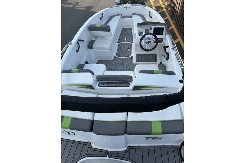 Slide: The Image of 2024 Tahoe T16 boat interior with modern seating and steering console. - 6