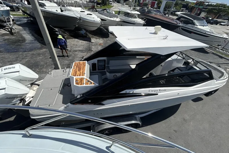Slide: The Image of 2024 L'acqua Royale LR280 GRAN CABRIO luxury boat displayed at a marina. - 19