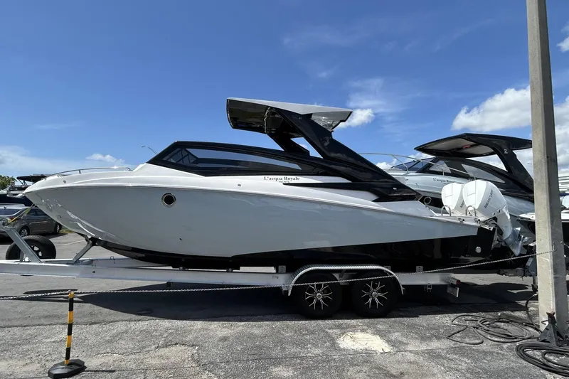 Slide: The Image of 2024 L'acqua Royale LR280 GRAN CABRIO luxury boat on trailer under clear blue sky. - 21