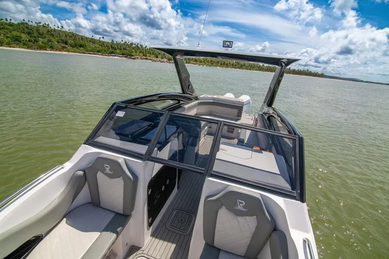 Slide: The Image of 2024 L'acqua Royale LR280 GRAN CABRIO luxury boat on serene water under blue sky. - 3