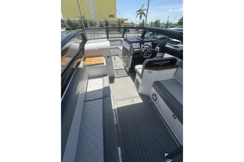 Slide: The Image of 2024 L'acqua Royale LR280 GRAN CABRIO luxury boat interior with sleek seating and modern dashboard. - 38