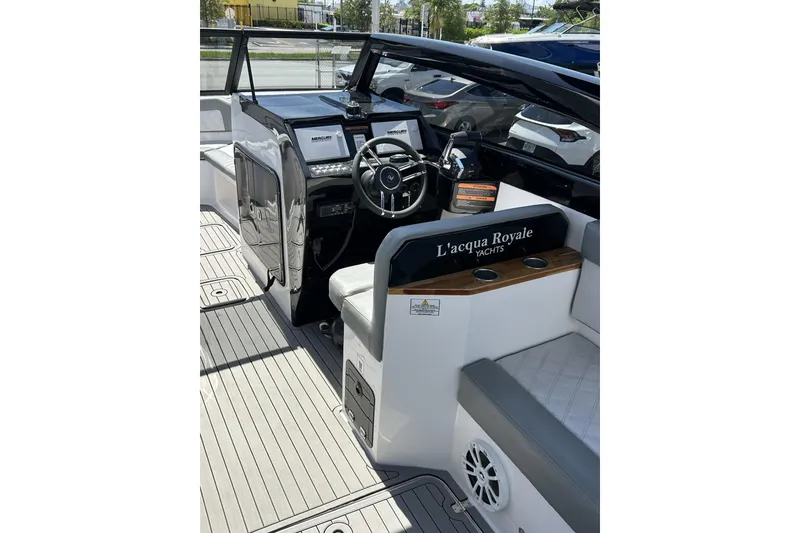 Slide: The Image of 2024 L'acqua Royale LR280 GRAN CABRIO yacht interior with steering wheel and seating. - 39