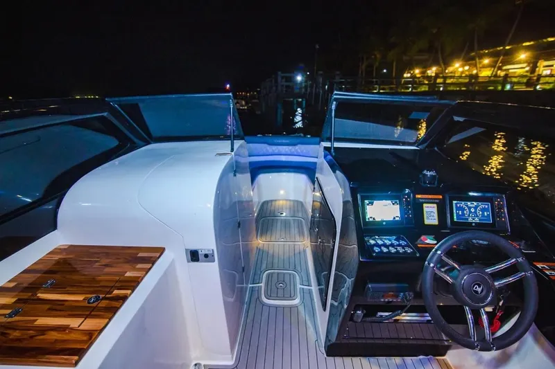 Slide: The Image of 2024 L'acqua Royale LR280 GRAN CABRIO yacht interior at night, featuring sleek dashboard and controls. - 4