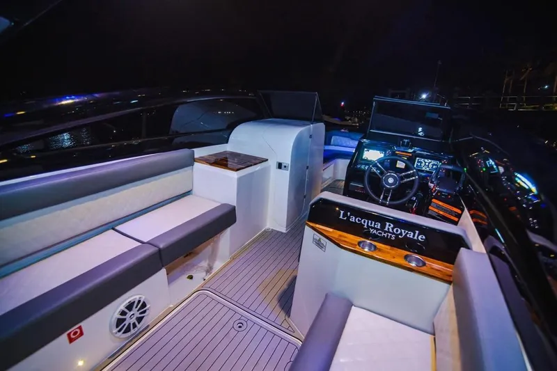 Slide: The Image of 2024 L'acqua Royale LR280 GRAN CABRIO yacht interior with luxurious seating and modern dashboard. - 6