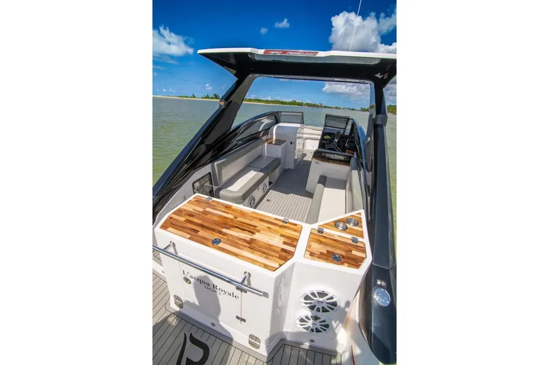 Slide: The Image of 2024 L'acqua Royale LR280 GRAN CABRIO luxury boat interior with sleek design and wood accents. - 7