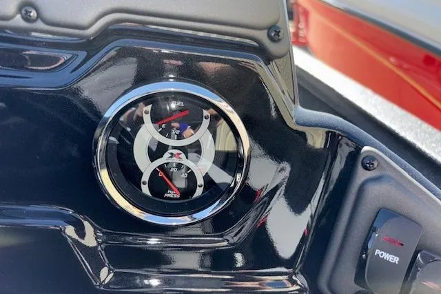 Slide: The Image of Dashboard of 2026 Xpress H18C Crappie boat with gauges and power switch. - 24