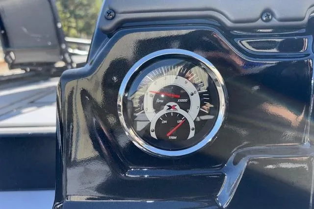 Slide: The Image of Close-up of 2026 Xpress H18C Crappie boat dashboard gauge. - 26