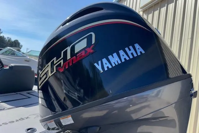 Slide: The Image of 2026 Xpress H18C Crappie boat with Yamaha VMAX SHO engine, outdoor setting. - 31