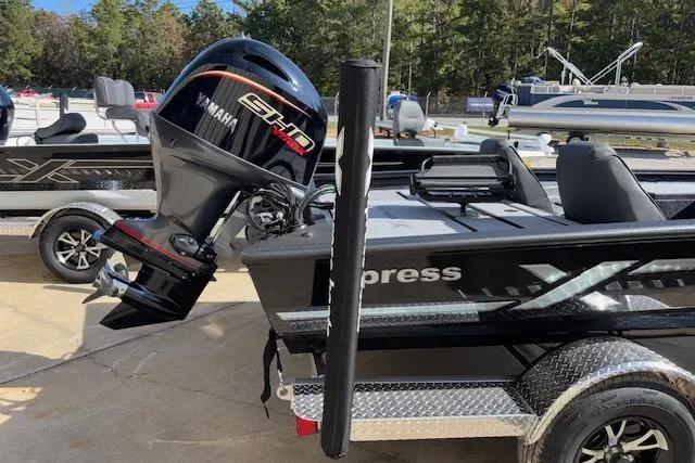 Slide: The Image of 2026 Xpress H18C Crappie boat with Yamaha engine, parked outdoors. - 8
