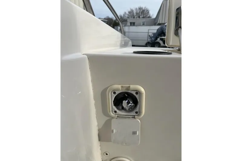 Slide: The Image of 2014 Boston Whaler Dauntless 240 boat detail showing a fuel cap. - 12