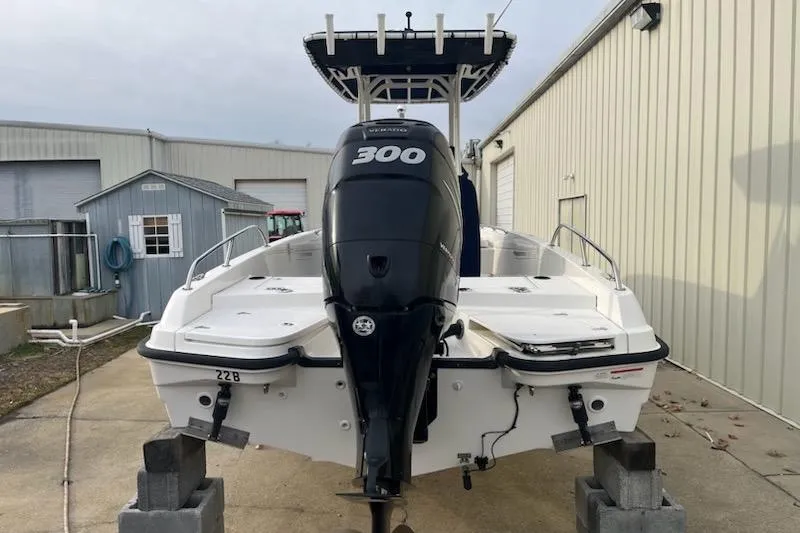 Slide: The Image of 2014 Boston Whaler Dauntless 240 with powerful 300 HP engine, docked outdoors. - 4