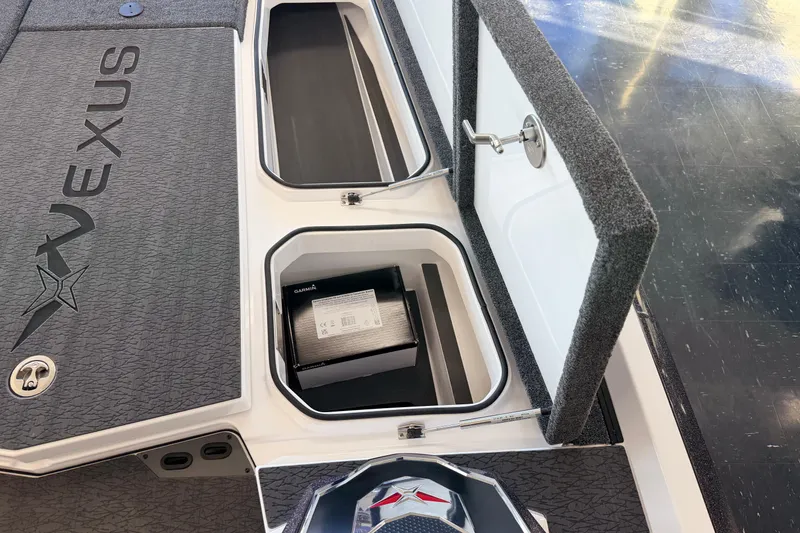Slide: The Image of 2026 Vexus VXS20 boat storage compartments with Garmin equipment. - 17