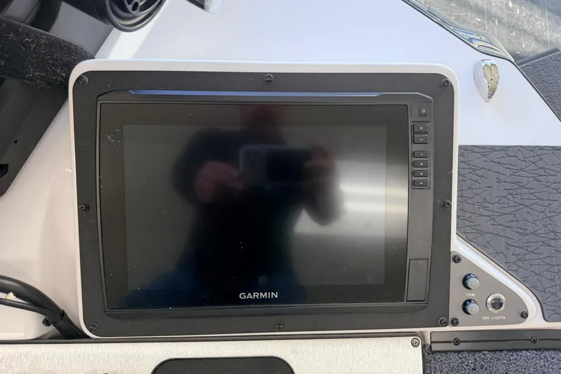 Slide: The Image of Garmin display on 2026 Vexus VXS20 boat dashboard, featuring control buttons. - 22