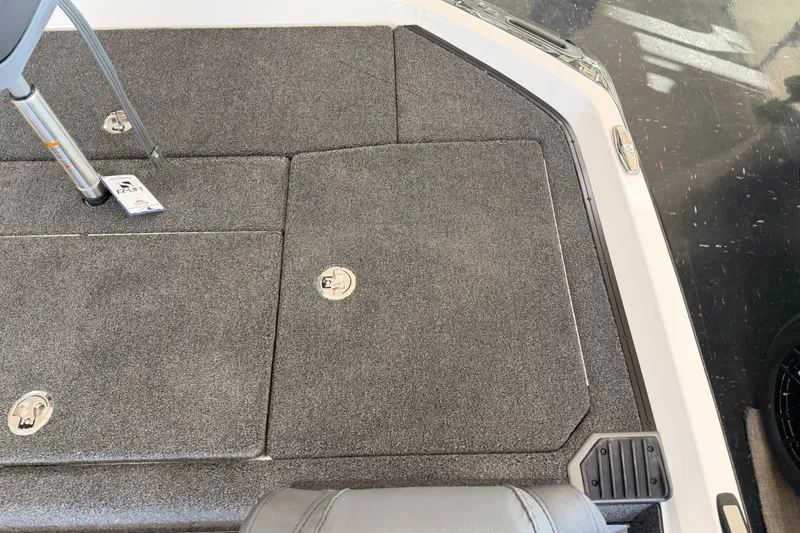 Slide: The Image of 2026 Vexus VXS20 boat deck with gray carpet and storage compartments. - 29