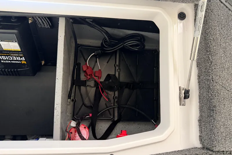 Slide: The Image of 2026 Vexus VXS20 boat battery compartment with wiring and charger. - 32