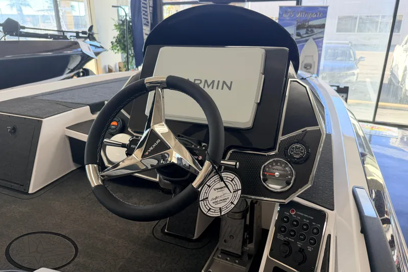Slide: The Image of 2026 Vexus VXS20 boat dashboard with Garmin display and steering wheel. - 8