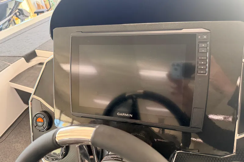 Slide: The Image of 2026 Vexus VXS20 boat dashboard with Garmin display and steering wheel. - 9