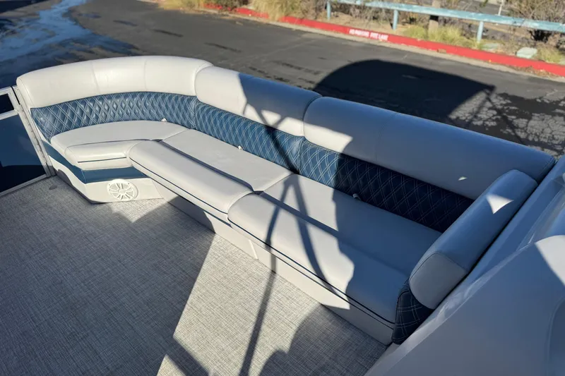 Slide: The Image of Luxurious seating on 2023 Nepallo 22TL boat with elegant blue and gray upholstery. - 12