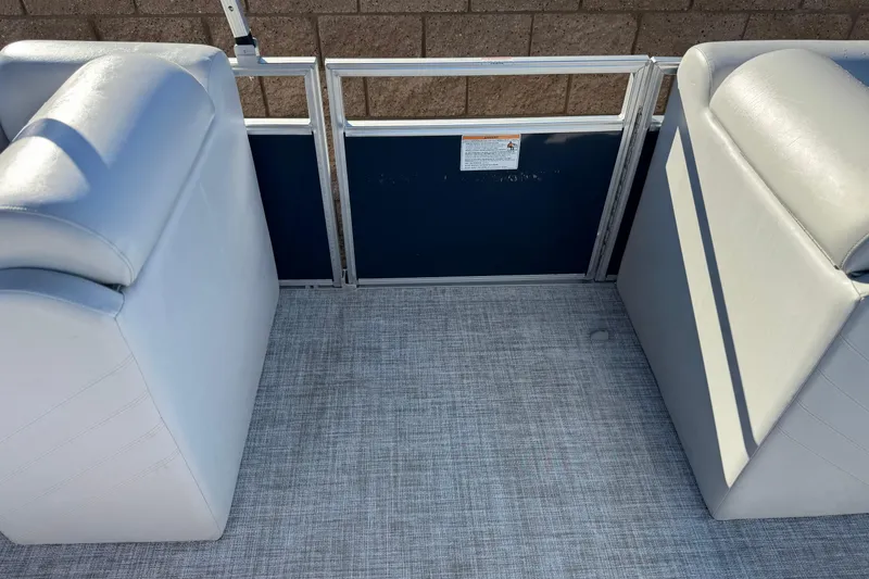 Slide: The Image of 2023 Nepallo 22TL boat interior with gray seating and textured flooring. - 13