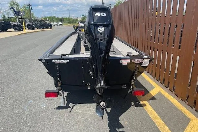 Slide: The Image of 2019 Tracker Panfish 16 boat with 40 HP motor, parked on a sunny day. - 7