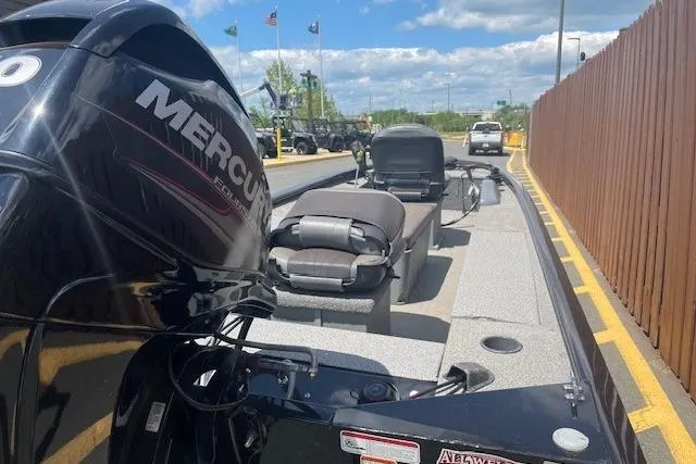 Slide: The Image of 2019 Tracker Panfish 16 boat with Mercury engine, parked outdoors on a sunny day. - 8