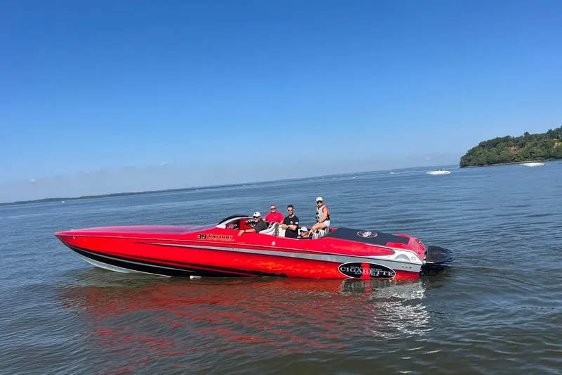 Slide: The Image of 2011 Cigarette 39' Top Gun Unlimited boat with racing team logo. - 10