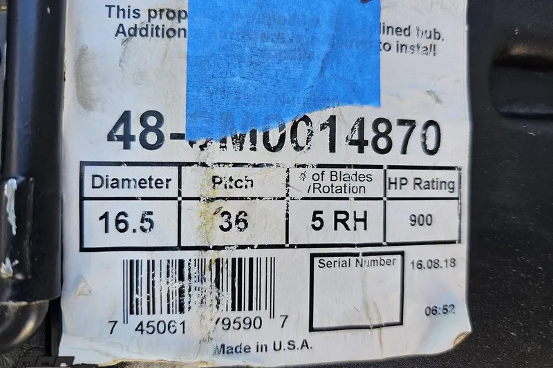 Slide: The Image of Label on a 2011 Cigarette 39' Top Gun Unlimited, showing propeller specifications. - 108