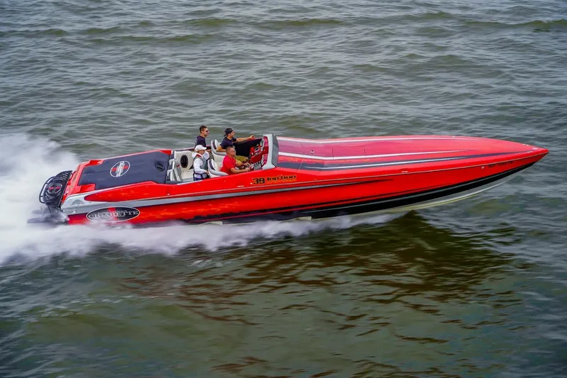 Slide: The Image of 2011 Cigarette 39' Top Gun Unlimited speedboat racing on water. - 109