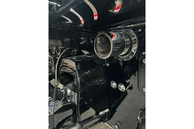 Slide: The Image of 2011 Cigarette 39' Top Gun Unlimited speedboat on trailer, vibrant red and black design. - 21