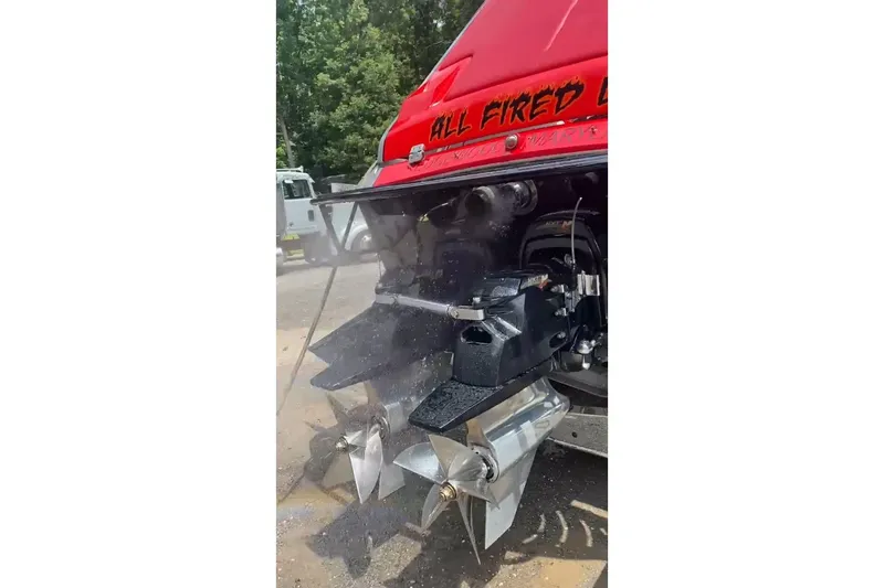 Slide: The Image of 2011 Cigarette 39' Top Gun Unlimited boat on trailer, red and black design. - 22