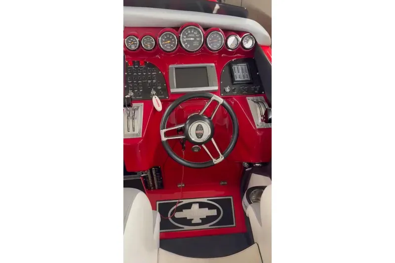 Slide: The Image of 2011 Cigarette 39' Top Gun Unlimited boat on trailer, vibrant red and silver design. - 29