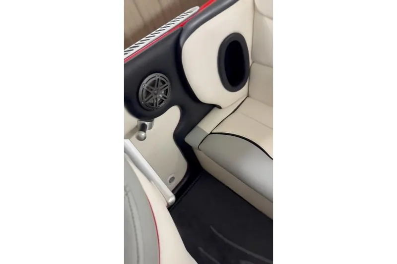 Slide: The Image of 2011 Cigarette 39' Top Gun Unlimited boat, red and black, parked on a trailer. - 37