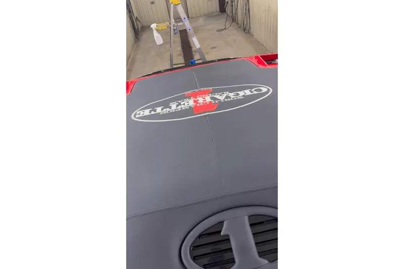 Slide: The Image of 2011 Cigarette 39' Top Gun Unlimited boat, red with black and white accents, aerial view. - 39