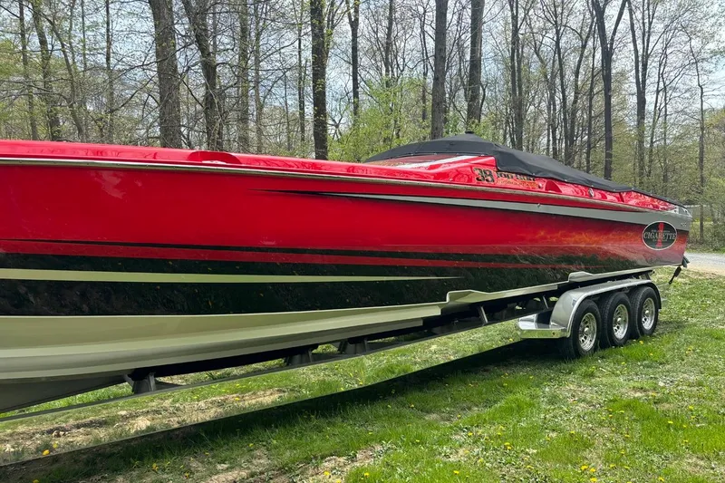 Slide: The Image of 2011 Cigarette 39' Top Gun Unlimited boat on trailer at Grand Sport Center. - 4