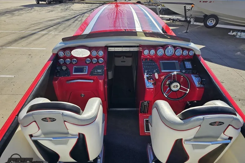 Slide: The Image of Interior of a 2011 Cigarette 39' Top Gun Unlimited speedboat with red and white design. - 50