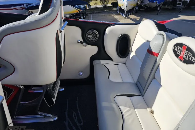 Slide: The Image of Interior of 2011 Cigarette 39' Top Gun Unlimited boat with white leather seating. - 54