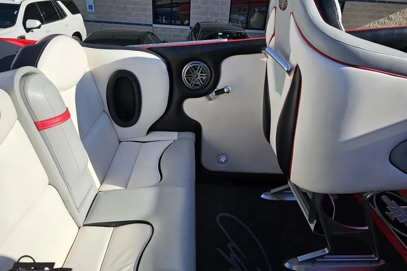 Slide: The Image of Interior of a 2011 Cigarette 39' Top Gun Unlimited boat with white and red seating. - 56