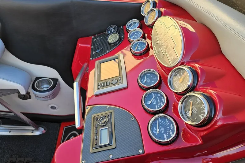 Slide: The Image of Dashboard of 2011 Cigarette 39' Top Gun Unlimited boat with gauges and controls. - 63