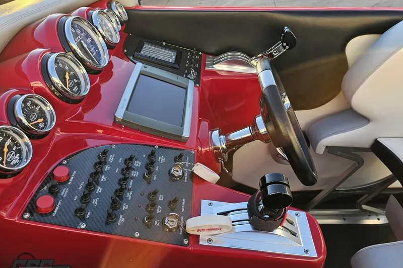 Slide: The Image of Dashboard of a 2011 Cigarette 39' Top Gun Unlimited boat with gauges and controls. - 65