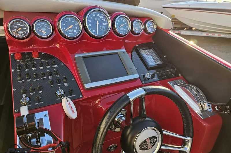 Slide: The Image of Dashboard of a 2011 Cigarette 39' Top Gun Unlimited boat with gauges and controls. - 66
