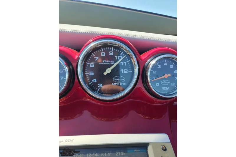 Slide: The Image of Dashboard of 2011 Cigarette 39' Top Gun Unlimited with speedometer and RPM gauges. - 69